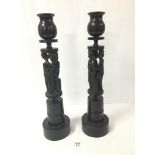 PRIVATE COLLECTION OF A BRIGHTON RESIDENT: A PAIR OF AFRICAN TURNED WOODEN CANDLESTICKS, 50CM HIGH