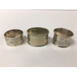 TWO VICTORIAN SILVER NAPKIN RINGS WITH ENGRAVED FLORAL MOTIFS, EARLIEST HALLMARKED LONDON 1886 BY