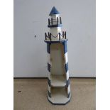 A BLUE AND WHITE LIGHTHOUSE SHELF UNIT 95CMS.