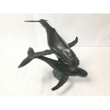 A BRONZE FIGURAL GROUP DEPICTING TWO HUMPBACK WHALES, 44CM WIDE
