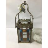 A LARGE BRASS AND GLASS HANGING LANTERN WITH COLOURED GLASS INSERTS, APPROXIMATELY 55CM HIGH