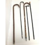 A GROUP OF FIVE VINTAGE WALKING STICKS