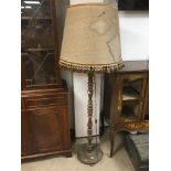 A FRENCH OAK STANDARD LAMP.