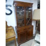 A FLAME MAHOGANY DISPLAY UNIT WITH CUPBOARD