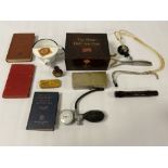 A COLLECTION OF ASSORTED MEDICAL INSTRUMENTS, BOOKS, SEDATIVE TIN AND MORE