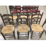 SIX RUSTIC OAK LADDER BACK CHAIRS.