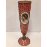 A LARGE VICTORIAN CRANBERRY GLASS VASE/GOBLET ON PEDESTAL BASE, DECORATED THROUGHOUT WITH GILT