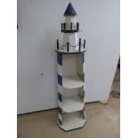 A BLUE AND WHITE LIGHTHOUSE SHELF UNIT 140CMS