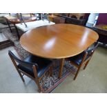 A TEAK RETRO DINING EXTENDING TABLE BY MCINTOSH WITH FOUR MATCHING RETRO CHAIRS.