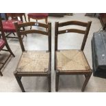 A PAIR OF OAK COUNTRY STYLE CHAIRS.