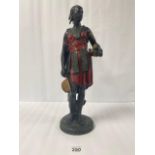 A LARGE PAINTED SPELTER FIGURE OF A TRIBESWOMEN, 51.5CM HIGH