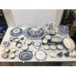 AN EXTENSIVE COLLECTION OF BLUE AND WHITE CERAMICS, INCLUDING OLD WILLOW PATTERN AND MUCH MORE