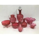 A COLLECTION OF ASSORTED CRANBERRY GLASS, INCLUDING DECANTER WITH STOPPER, TWO POURING JUGS AND