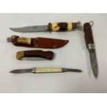 A GROUP OF VINTAGE KNIVES OF VARYING SHAPES AND SIZES