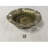 A HEAVY SILVER PLATED MAGNUM CHAMPAGNE BOTTLE COASTER WITH PIERCED AND ETCHED GRAPE AND VINE BORDER,