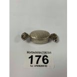 A NOVELTY SILVER PILL BOX IN THE FORM OF A SWEET, MARKED 925, 11.6G