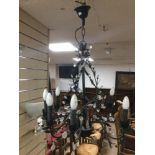 BLACK METAL CHANDELIER WITH A PAIR OF ART DECO STYLE WALL LIGHTS.