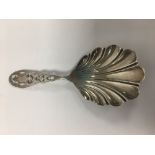 A VICTORIAN SILVER SHELL SHAPED CADDY SPOON WITH PIERCED HANDLE, HALLMARKED SHEFFIELD 1860 BY MARTIN