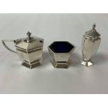 A THREE PIECE SILVER CONDIMENT SET OF HEXAGONAL FORM, HALLMARKED BIRMINGHAM 1930 BY DEAKIN & FRANCIS