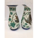 A PAIR OF LARGE PORCELAIN VASES WITH SCENES ADORNING THE SIDES OF HANGING GAME BIRDS AMONGST IVY,