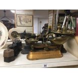 TWO SETS OF FRENCH WEIGHING SCALES WITH AN ASSORTMENT OF WEIGHTS, LARGEST 57CM WIDE