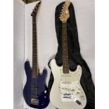 TWO GUITARS, A BASS GUITAR BY ARIA PRO II AND A GEAR FOR MUSIC GUITAR.