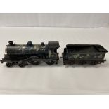 AN EARLY CLOCKWORK WIND UP LOCOMOTIVE WITH TENDER, BLUE PAINTED WITH LETTERING GR 77, APPROX 42CM