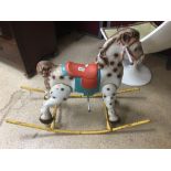 A VINTAGE CHILDS METAL ROCKING HORSE 108CM WIDE