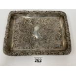 A LATE VICTORIAN SILVER EMBOSSED DRESSING TABLE TRAY OF RECTANGULAR FORM, HALLMARKED 1901 BY