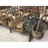 SIX VINTAGE WICKER BASKETS, LARGEST 48CM HIGH, TOGETHER WITH A METAL WINE BOTTLE RACK