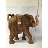 AN EXCEPTIONALLY LARGE CARVED WOODEN ELEPHANT, 51CM BY 51CM WIDE
