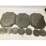 A SET OF TEN VINTAGE PEWTER PLACE SETTINGS WITH EIGHT COASTERS BY VMC FECIT, THE SETTINGS