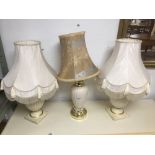 A PAIR OF MODERN LAMPS WITH ONE OTHER, ALL CERAMIC.