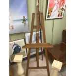 A LARGE OAK EASEL.