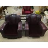 A PAIR OF VINTAGE ART DECO LEATHER OX BLOOD CHAIRS A/F.
