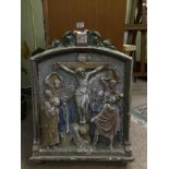 A FRENCH RELIGIOUS PLASTER WALL PLAQUE DEPICTING JESUS UPON THE CROSS SURROUNDED BY MOURNING