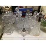 A COLLECTION OF CUT GLASS ITEMS, INCLUDING DECANTERS, TWO CLARET JUGS (BOTH AF) JELLY MOLDS AND