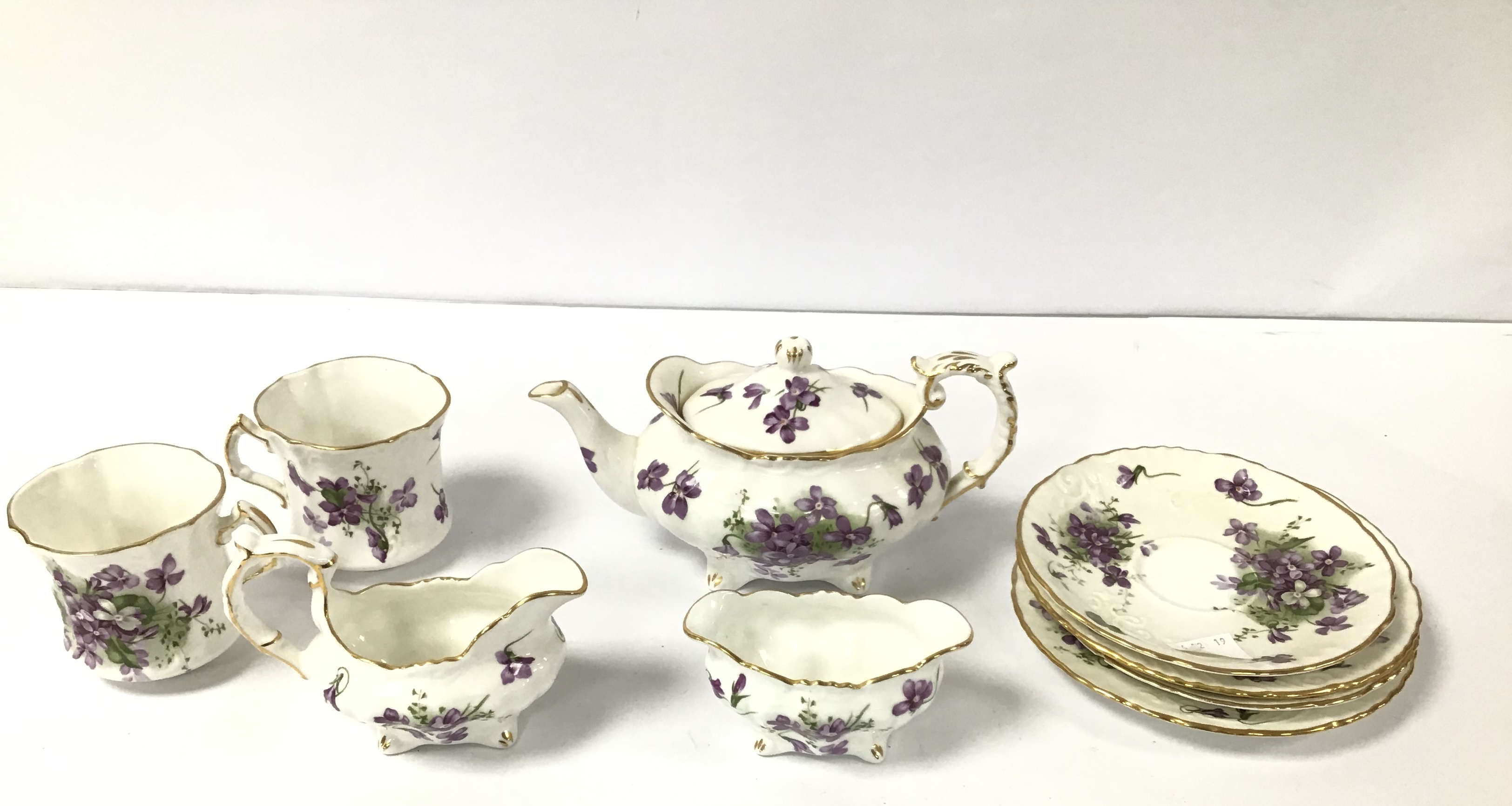 A HAMMERSLEY VICTORIAN VIOLETS PATTERN NINE PIECE BONE CHINA TEA SET, COMPRISING TEA POT, CUPS,