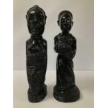 A PAIR OF CARVED WOODEN TRIBAL FIGURES OF WOMEN, LARGEST 42CM HIGH