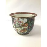 A CHINESE PORCELAIN JARDINIERE/PLANTER OF CIRCULAR FORM, DECORATED THROUGHOUT WITH SCENES IN POLY-