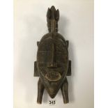 A LATE 19TH CENTURY WOODEN KPELIYE FACE MASK SENUFO PEOPLE IVORY COAST. A HORNBILL IS SITUATED AT