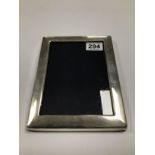 A SILVER MOUNTED PHOTO FRAME OF RECTANGULAR FORM, HALLMARKED SHEFFIELD 2004 BY CARRS OF SHEFFIELD,