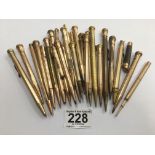 A LARGE COLLECTION OF GOLD PLATED PROPELLING PENCILS OF VARYING SHAPES AND DESIGNS