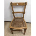A VICTORIAN CANE WORKED CHAIR