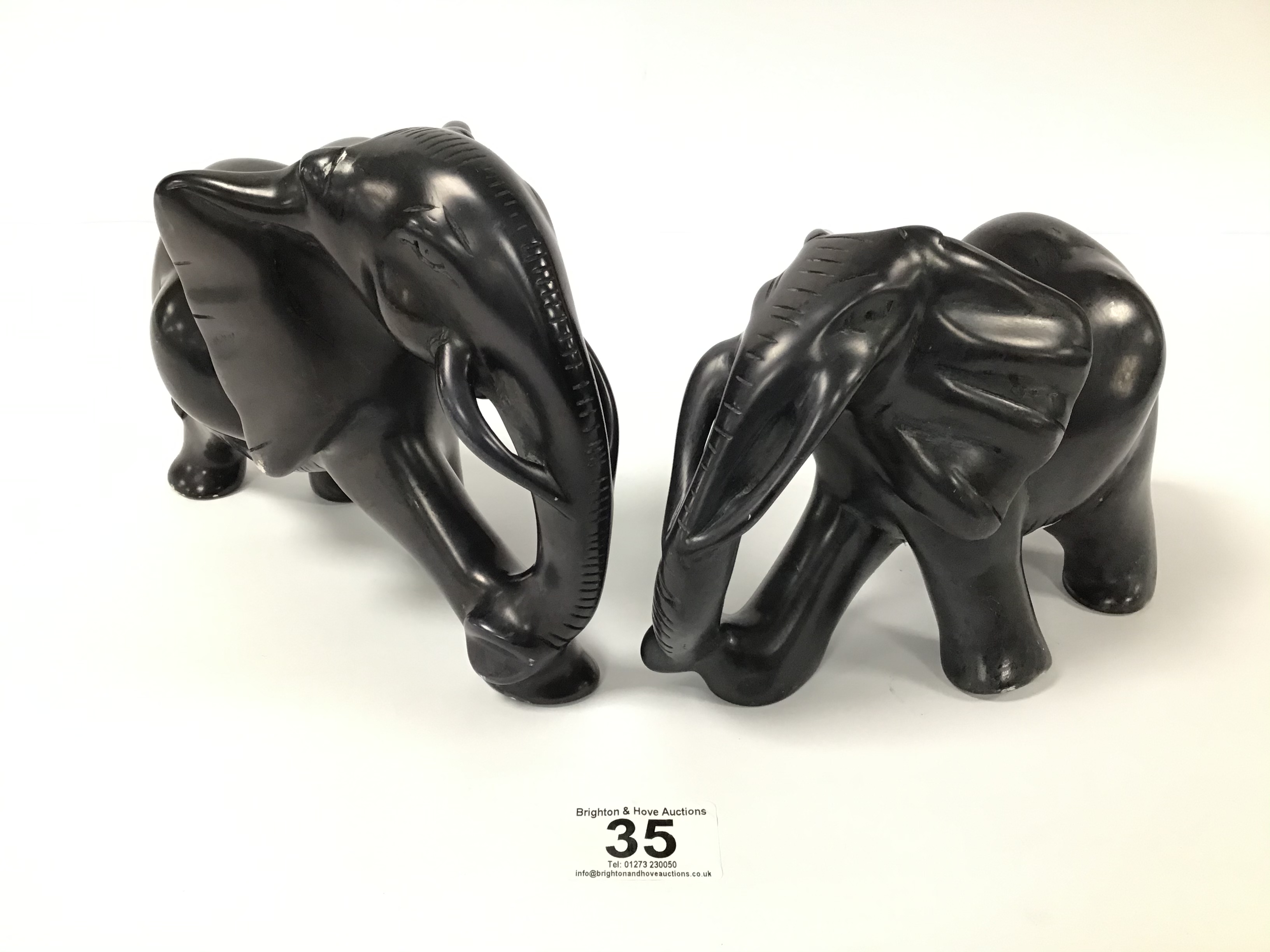 TWO CARVED HEAVY AFRICAN STONE FIGURES OF ELEPHANTS BY BESMO, LARGEST 23CM WIDE - Image 4 of 6