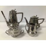 AN ART NOUVEAU FOUR PIECE PEWTER TEA SET BY HUTTON OF SHEFFIELD, IN THE LIBERTY STYLE, NUMBER TO