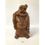 A CARVED WOODEN FIGURE OF A BUDDHA STYLE FIGURE, 42CM HIGH