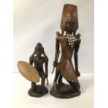 TWO CARVED AFRICAN TRIBAL FIGURES OF WARRIORS, LARGEST 51CM HIGH