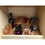 A LARGE COLLECTION OF ASSORTED DRINKING GLASSWARE, MOST COLOURED GLASS, INCLUDING DECANTERS, GLASSES