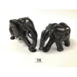 TWO CARVED HEAVY AFRICAN STONE FIGURES OF ELEPHANTS BY BESMO, LARGEST 23CM WIDE